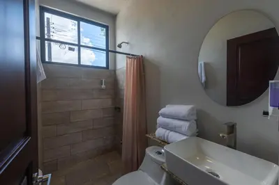 a bathroom with a shower and a toilet and a sink at Villas Fortuna Boutique in Fortuna