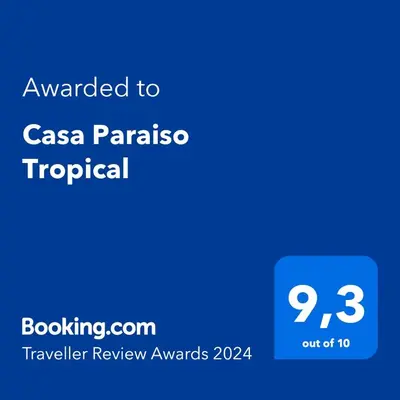 a screenshot of a cell phone with the text awarded to casa paraza tropical at Casa Paraiso Parrita in Parrita