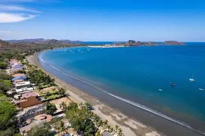 an aerial view of a beach with boats in the water at Playa Potrero - Cute, modern Containerhome with pool for 2 people in Potrero