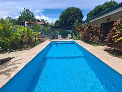 a swimming pool in the backyard of a house at Casa Uvita Bay in Uvita