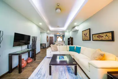 a living room with a couch and a table at Condo Casa Blanca 7 - NEW 2 BR condo, near to the beach in Potrero