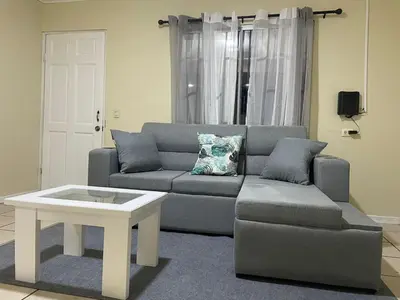 a living room with a couch and a coffee table at Navapart in San Isidro