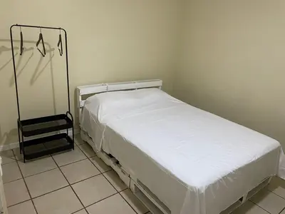 a bedroom with a white bed in a room at Navapart in San Isidro