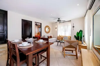 a living room with a wooden table and chairs at Apartment Calle La Ronda At Las Catalinas in Playa Danta