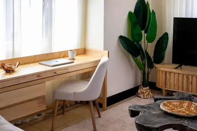 a desk with a laptop and a chair in a room at Apartment Calle La Ronda At Las Catalinas in Playa Danta