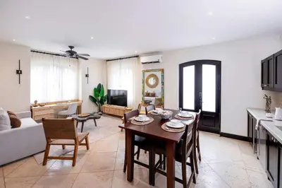 a living room with a table and a couch at Apartment Calle La Ronda At Las Catalinas in Playa Danta