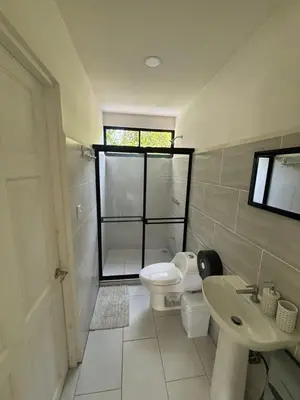 a bathroom with a toilet and a sink at Casa Mar 1 Manzanillo St Teresa in Boca de Ario