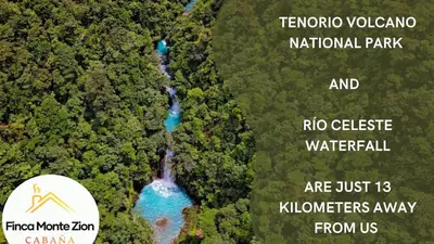 an aerial view of a river in a forest at Cabaña Montezion Bijagua in Bijagua