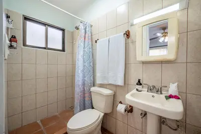 a bathroom with a toilet and a sink at Dolce Vita 7025 in Coco