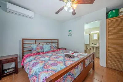 a bedroom with a bed and a ceiling fan at Dolce Vita 7025 in Coco