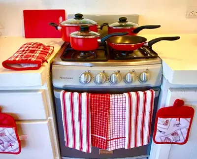 a stove with pots and pans on top of it at Cottage in Magic Mountain Views in Barrio Jesús